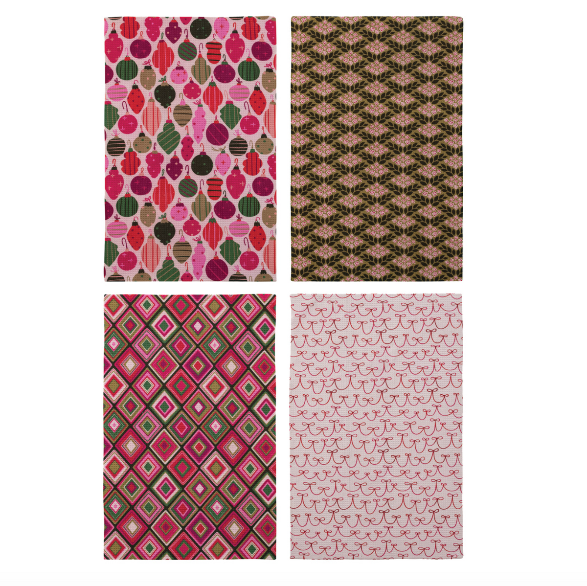 Assorted folded holiday tea towels with pink, green, and brown fruit, diamond, and scallop prints