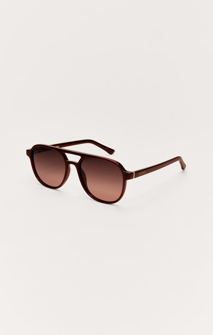 Brown polarized sunglasses with gradient lenses, side profile view