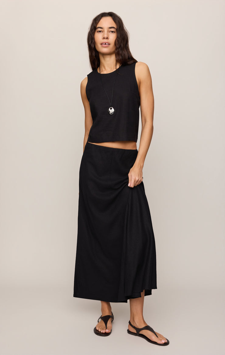 Black midi skirt with elastic waistband and flowing, straight-to-flare cut
