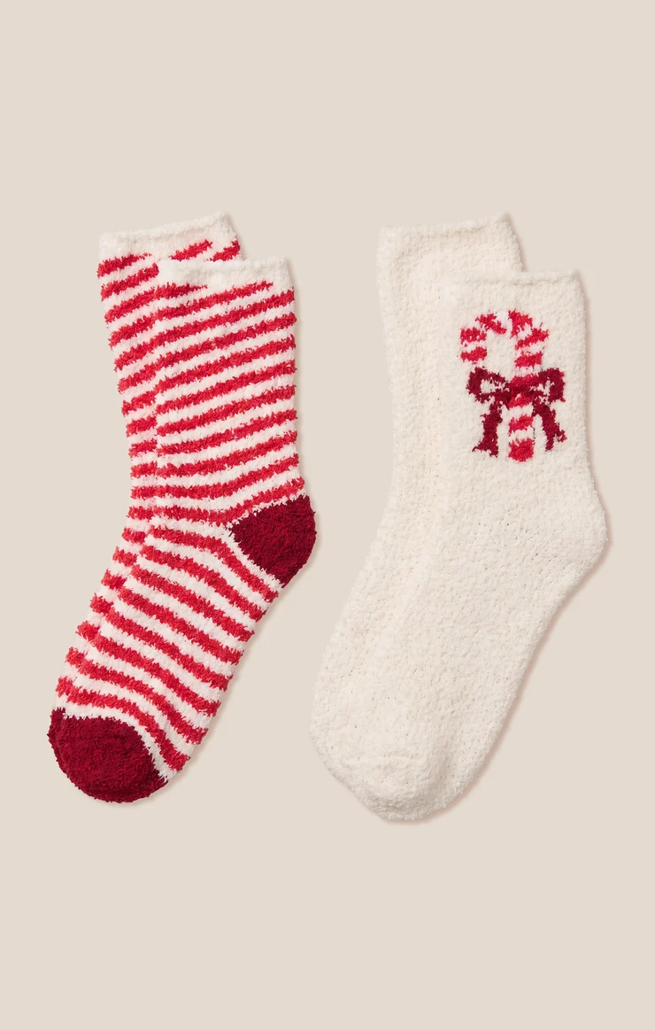 Candy cane socks set with red-and-white stripes and cream socks with red holiday motif.