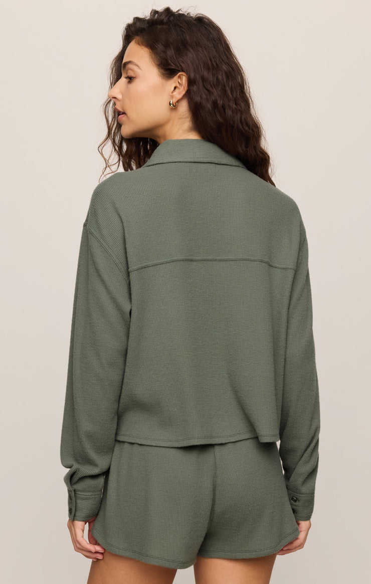 Dark green thermal shirt back view with long sleeves and curved hem