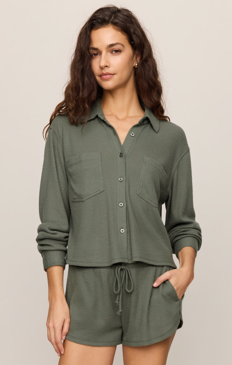 Dark green button-up thermal shirt with collar, long sleeves, and chest pockets