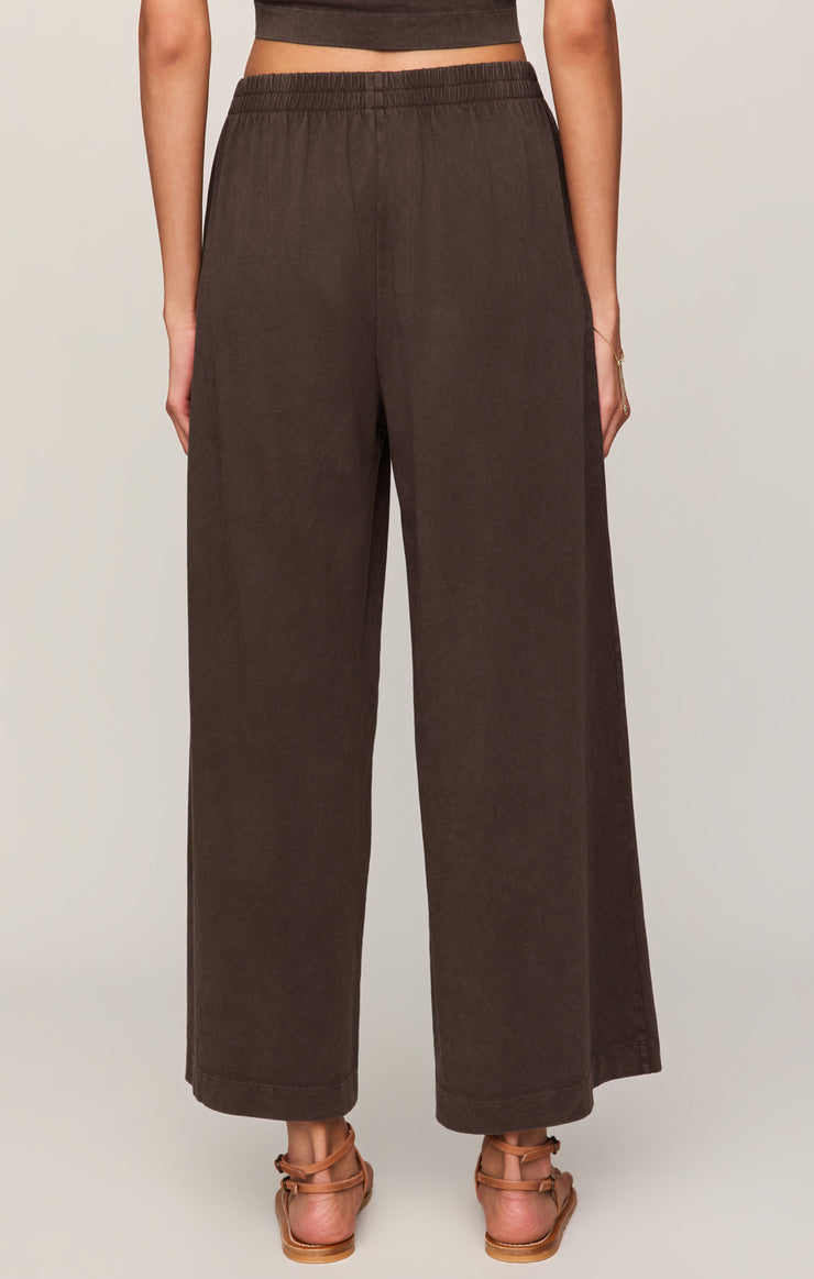 Dark brown jersey wide-leg pants with elastic waistband, relaxed straight legs
