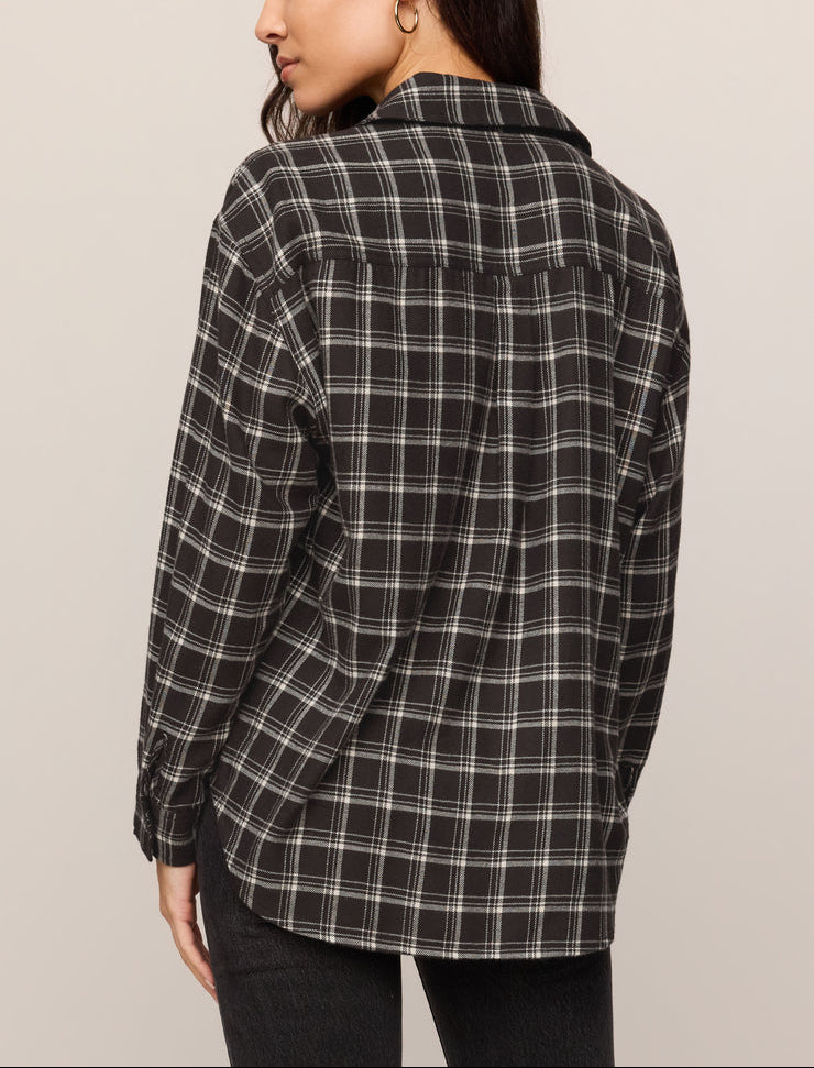 Back view of dark plaid button-up shirt with point collar and long sleeves