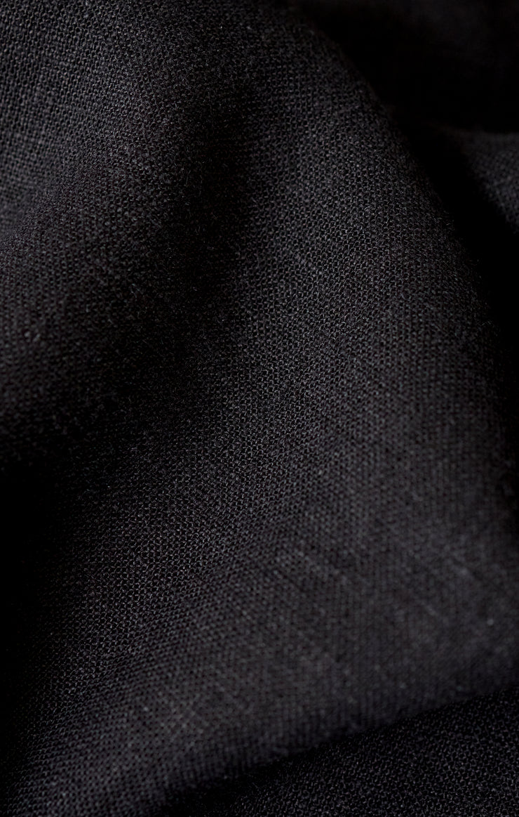 Sloane black linen fabric close-up with fine woven texture