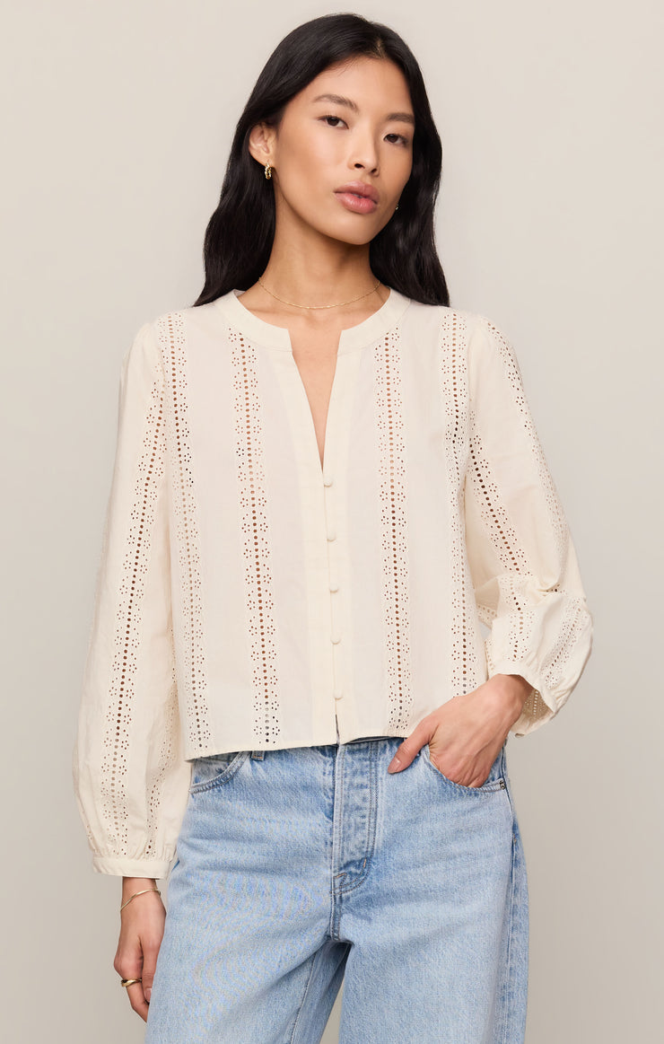 Off-white embroidered button-up top with V-neck and long puff sleeves