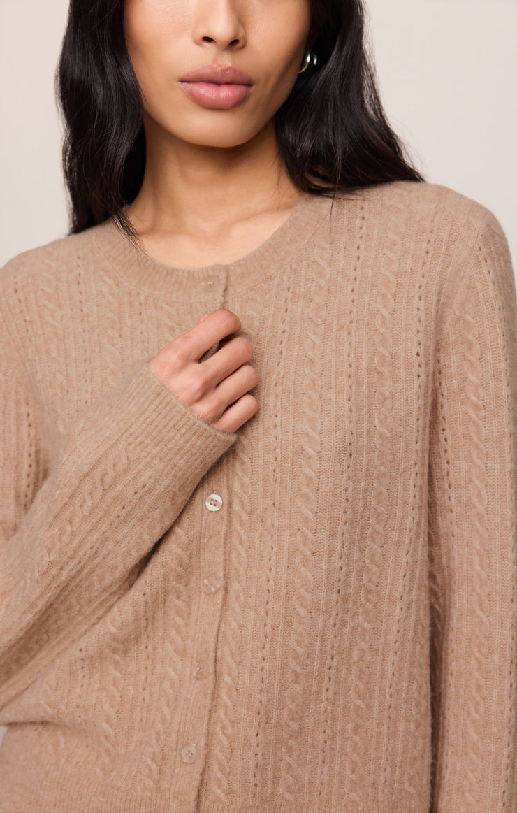 Macaroon pointelle cardigan close-up with round neckline and small button placket