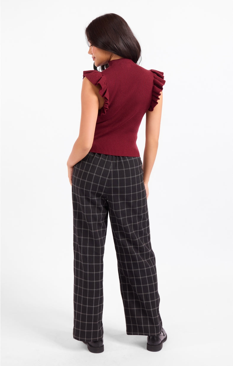 Burgundy mockneck ribbed tank sweater with ruffled shoulders, back side view