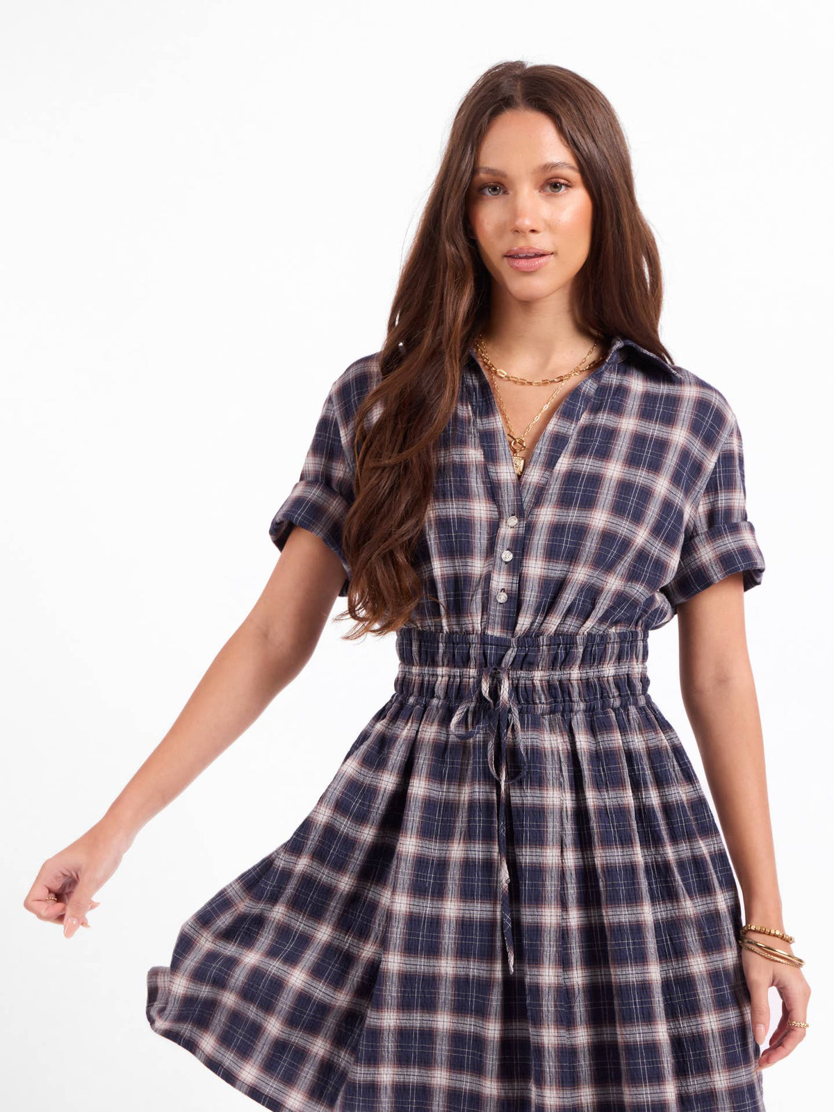 Navy plaid shirt dress with short sleeves, button front, and gathered waist