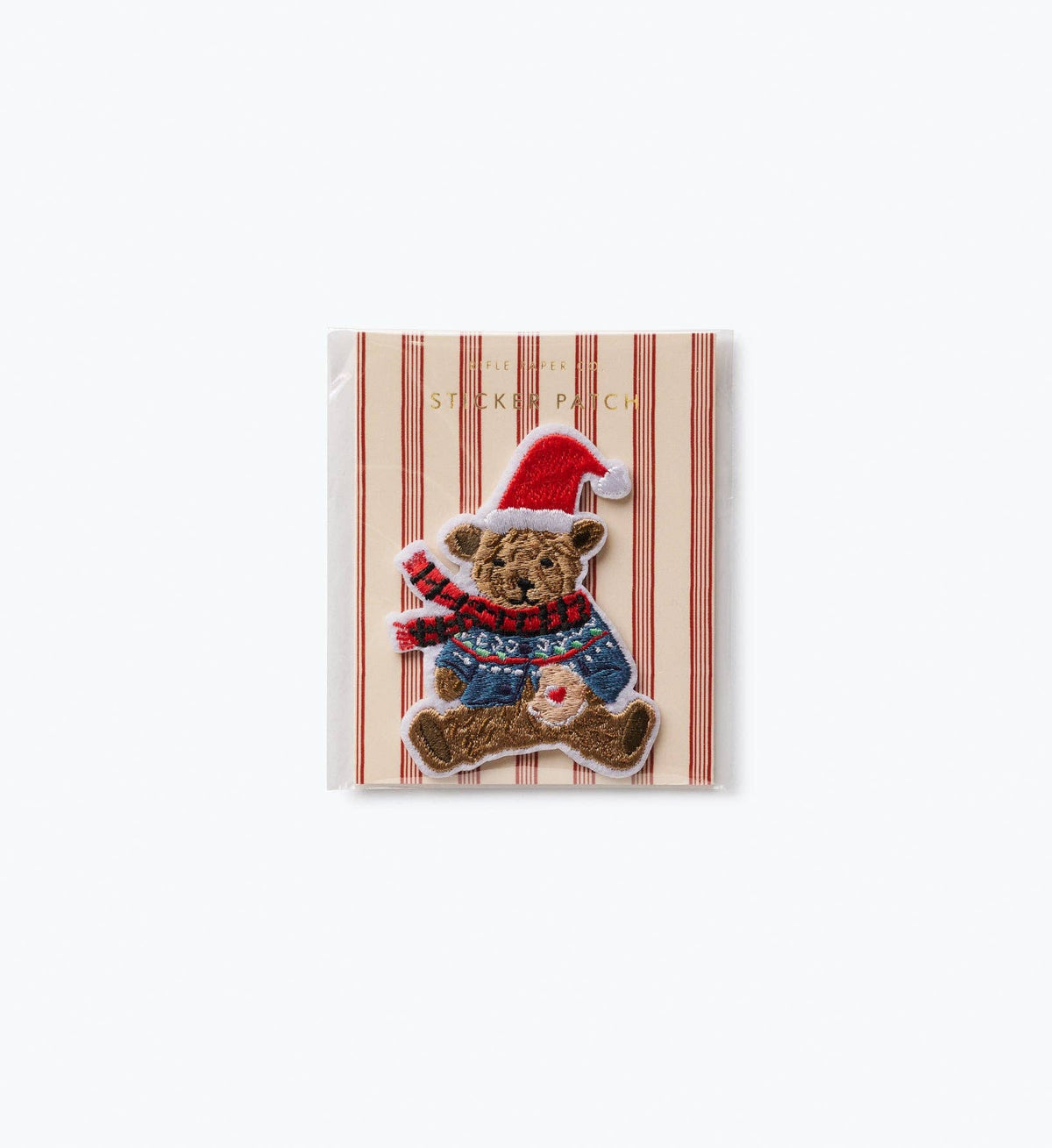 Embroidered iron-on patch of a bear in a red Santa hat, blue overalls, striped scarf