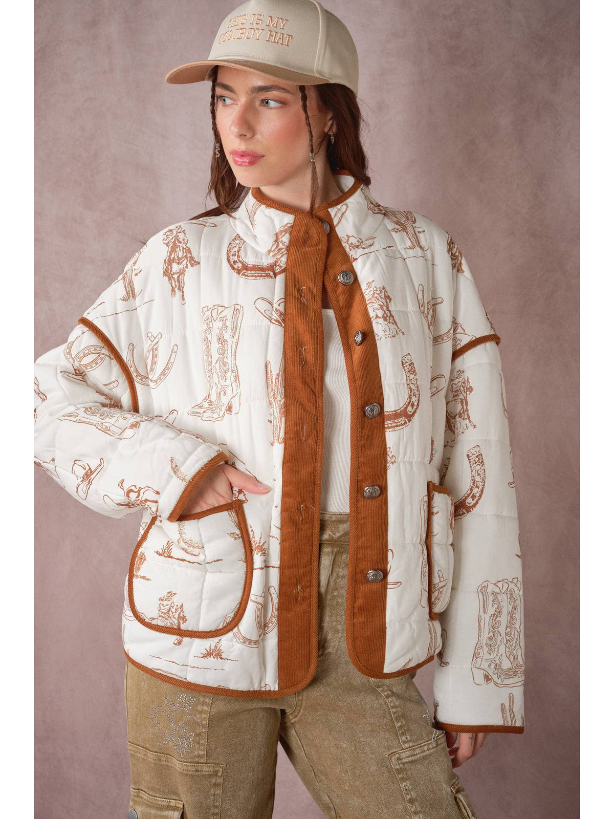 Western quilted jacket side view, white cowboy print, brown cord front with snap placket