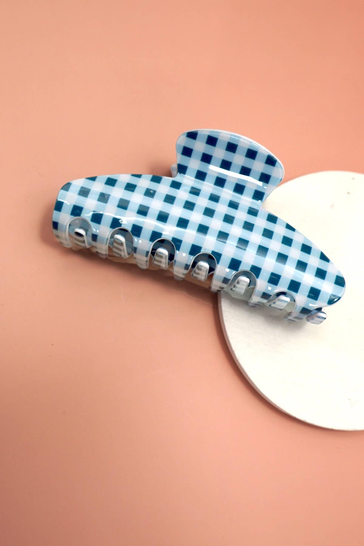 Blue checkered gingham oval jumbo hair claw clip with silver teeth.