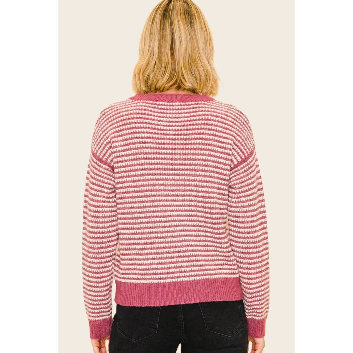 Women’s striped crewneck sweater in pink and white, long sleeves, back view