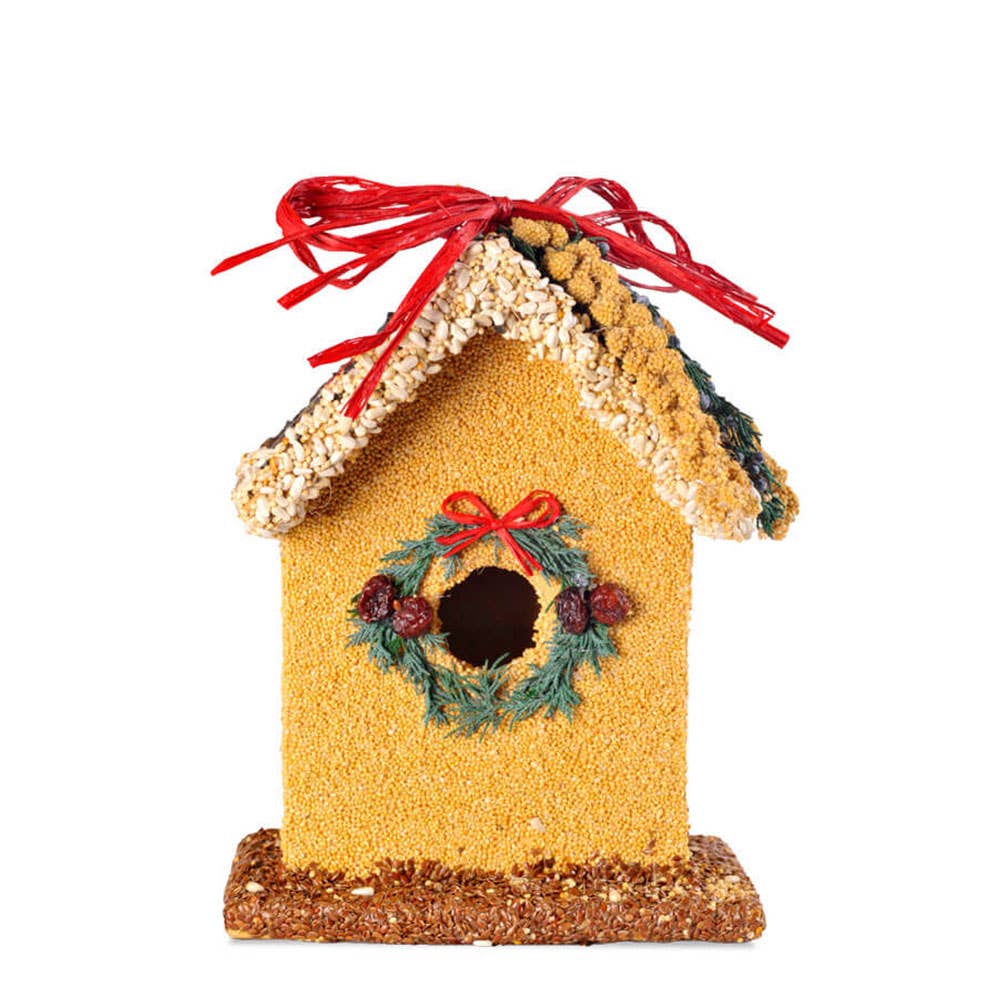 Yellow birdhouse ornament with wreath window and red bow on roof