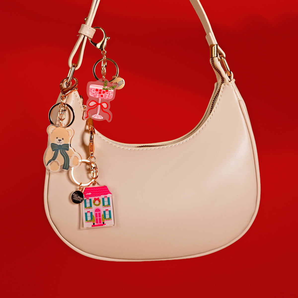 Teddy bear acrylic keychain with teal bow and assorted hanging charms