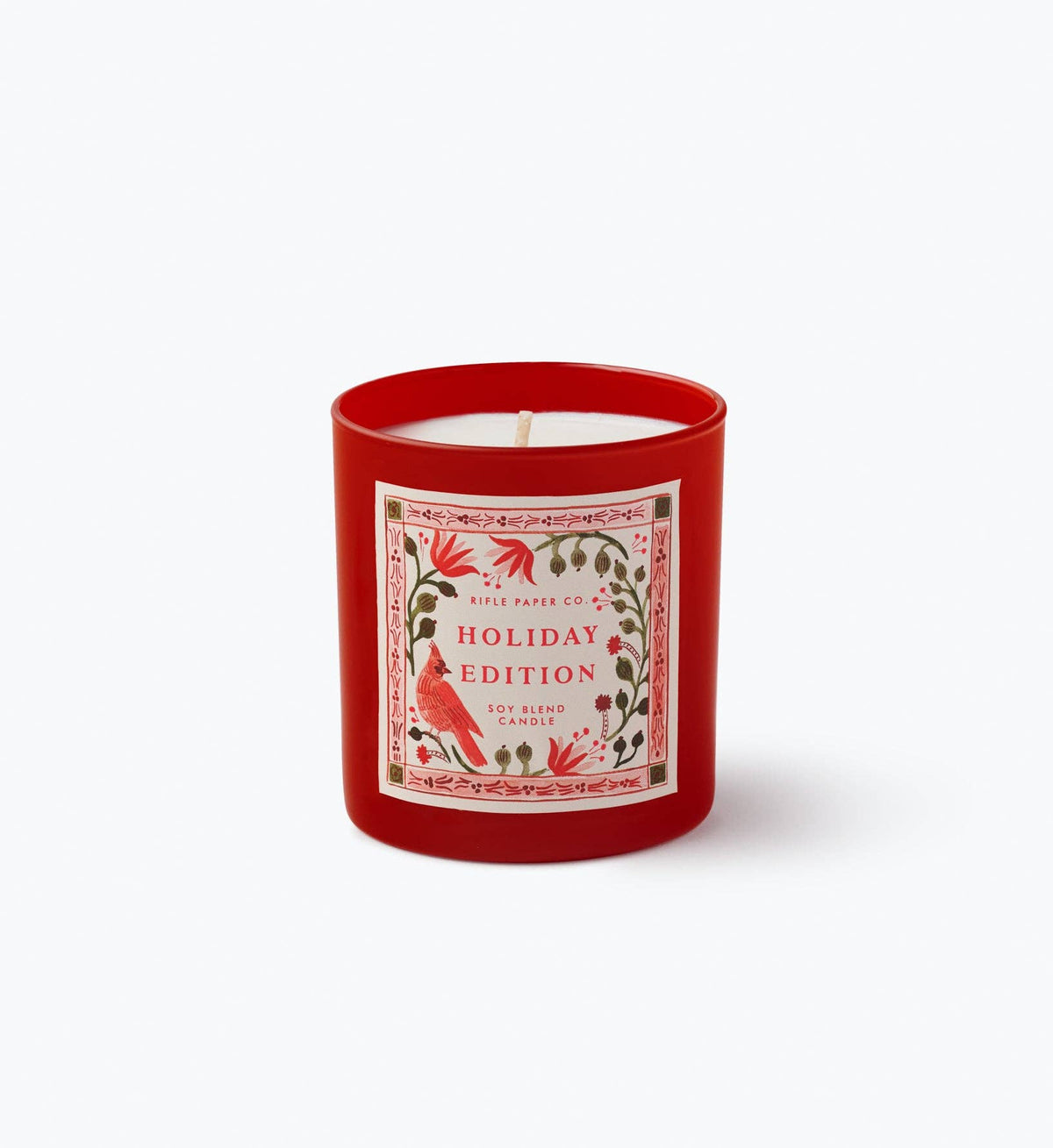 Red glass holiday candle with festive bird label and centered wick