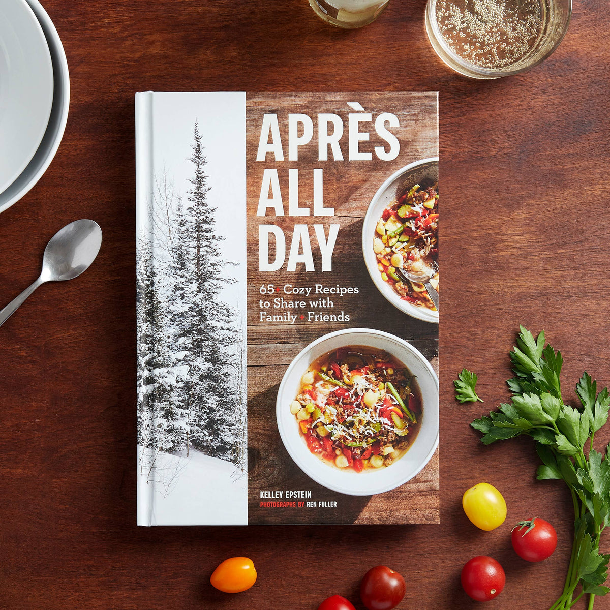 Apres All Day cookbook with winter tree cover and recipe bowls