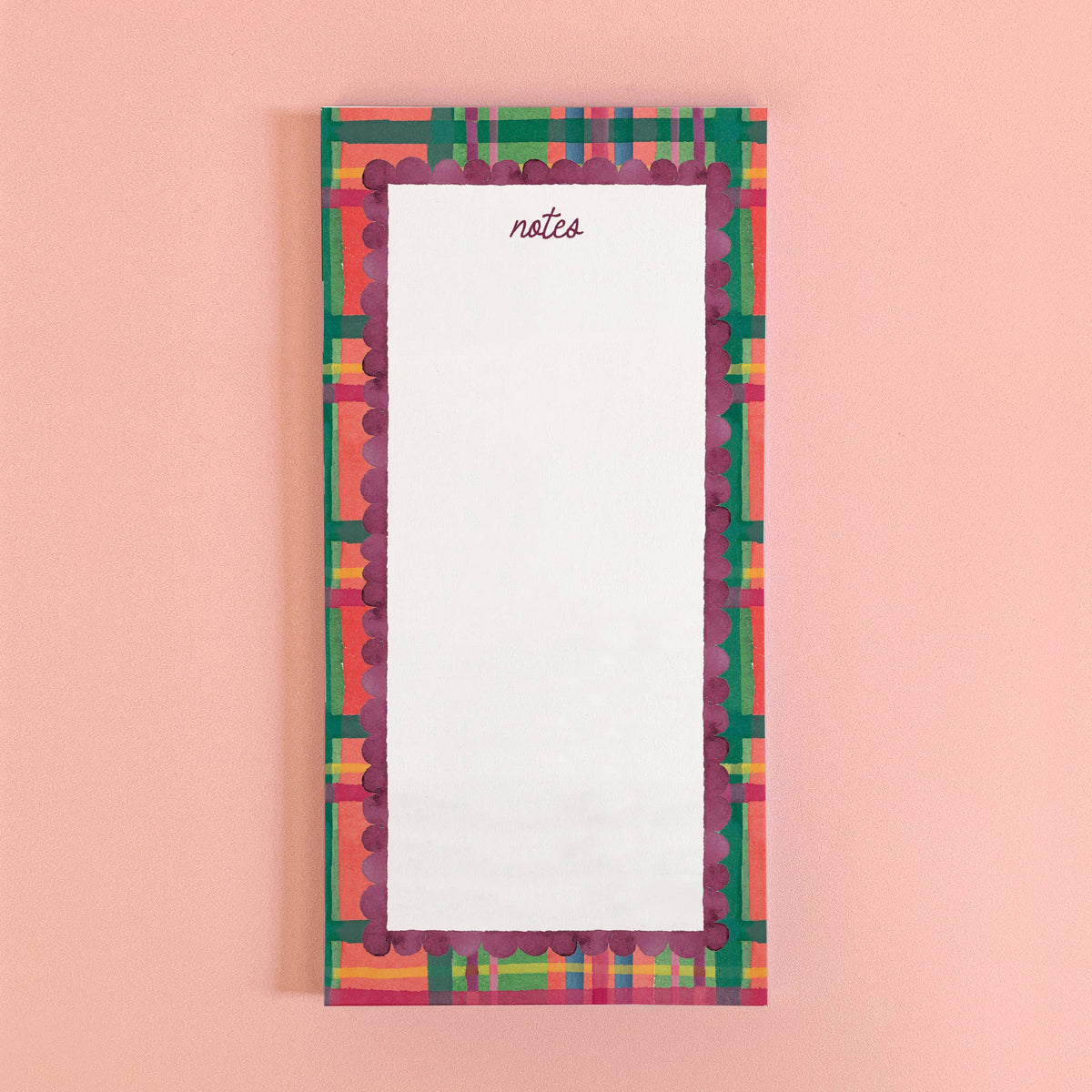 Plaid notepad with 'notes' on white pages, colorful frame border