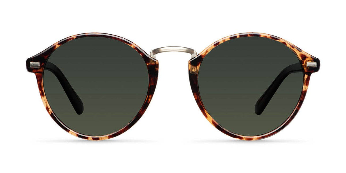 Round tortoiseshell sunglasses with dark lenses and metal bridge