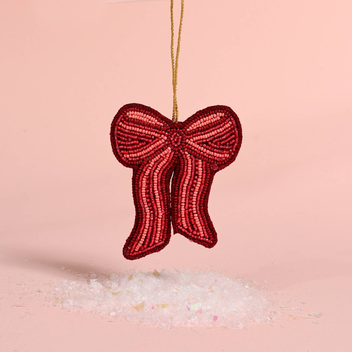 Red beaded ribbon bow ornament with gold hanging cord