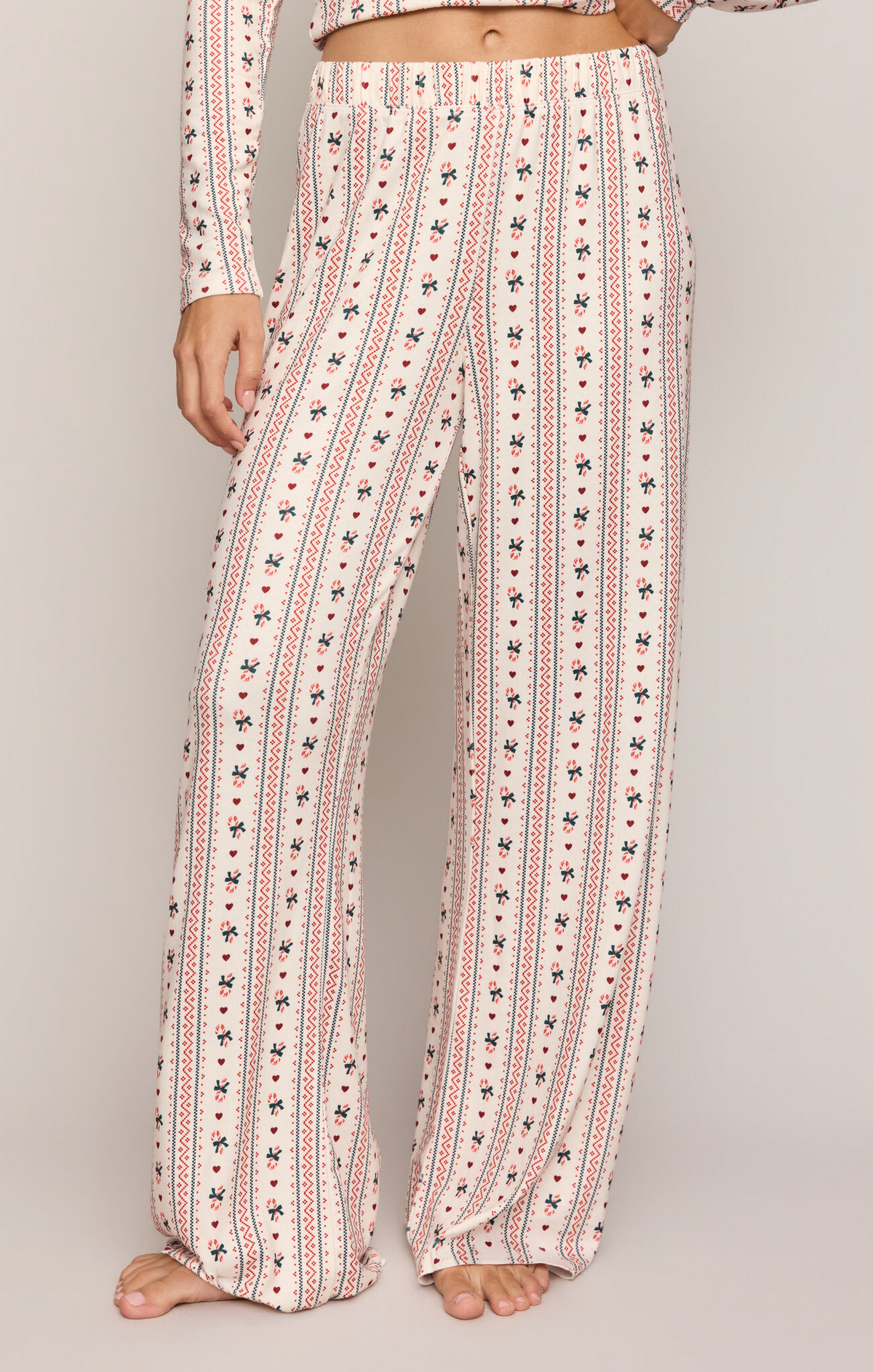Candy cane print pajama pants, wide-leg off-white stripes with red and blue motifs