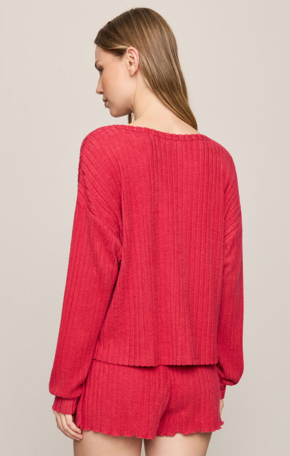 Ruby red ribbed knit long-sleeve top with relaxed back neckline