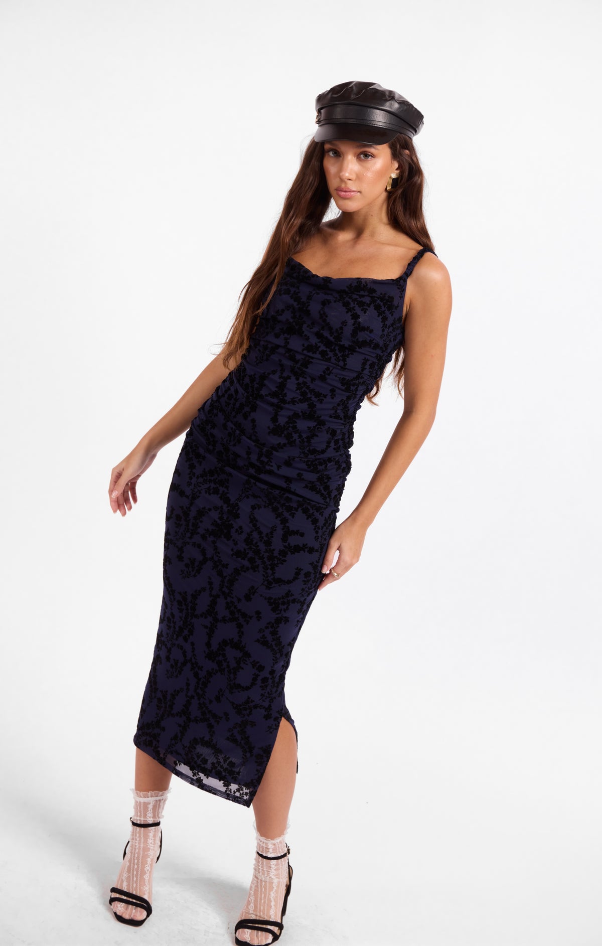 Ruched midi dress with spaghetti straps, dark floral pattern and slim fit
